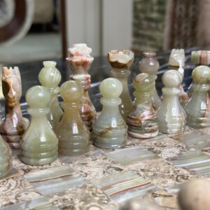 marble chess pieces coral green